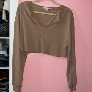 Size medium tan baggy long sleeve.